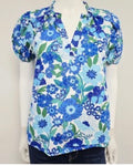 Avara blouse with a blue and green floral print and ruffle neck detail (30-day rental)