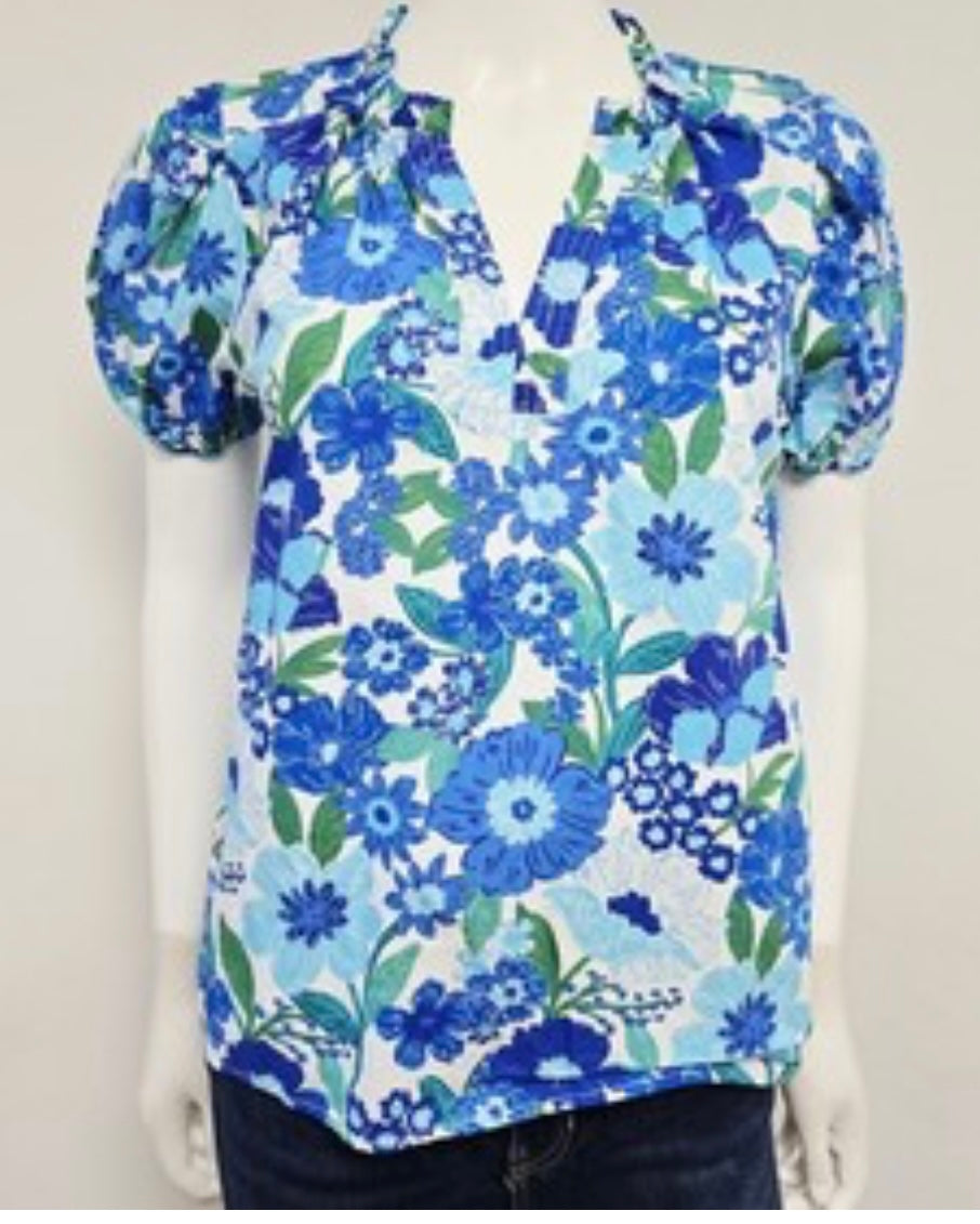 Avara blouse with a blue and green floral print and ruffle neck detail (30-day rental)