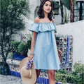 Denim dress in light wash chambray fabric and a ruffled off-the-shoulder neckline (30-day rental)