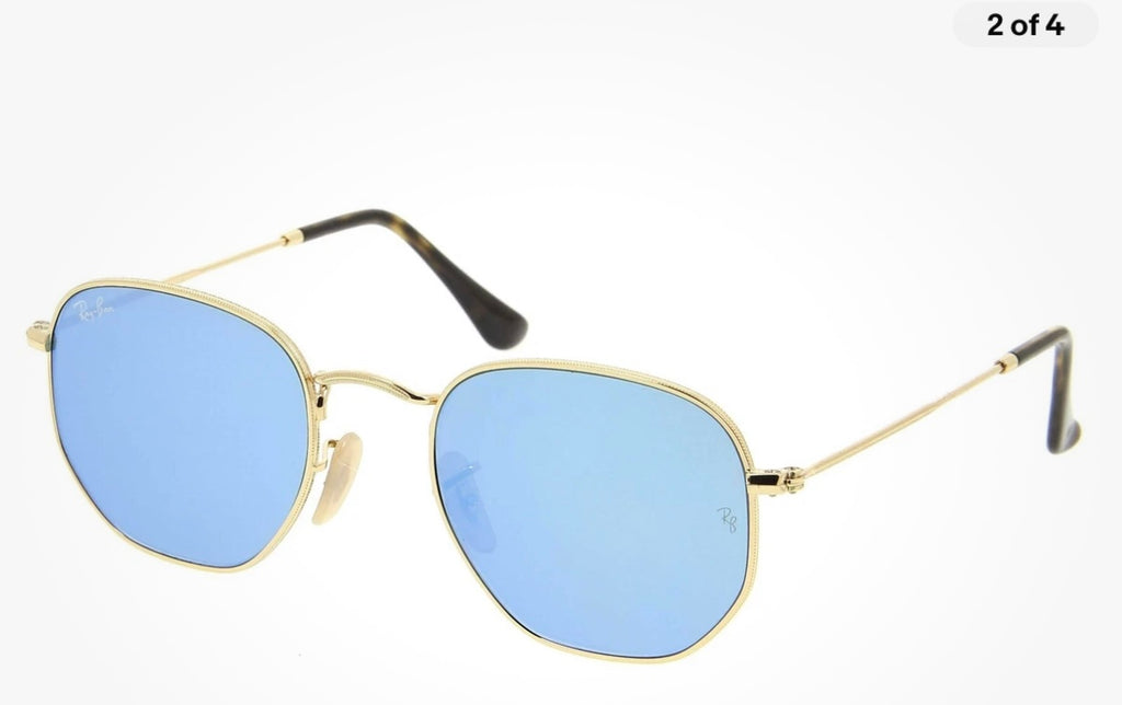 Ray-Ban Hexagonal sunglasses featuring a thin gold metal frame and striking blue mirror lenses (30-day rental)
