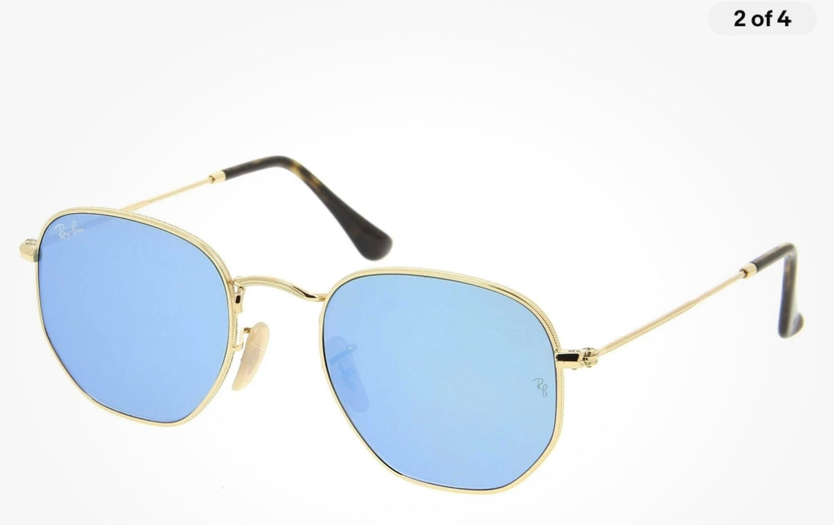Ray-Ban Hexagonal sunglasses featuring a thin gold metal frame and striking blue mirror lenses (30-day rental)