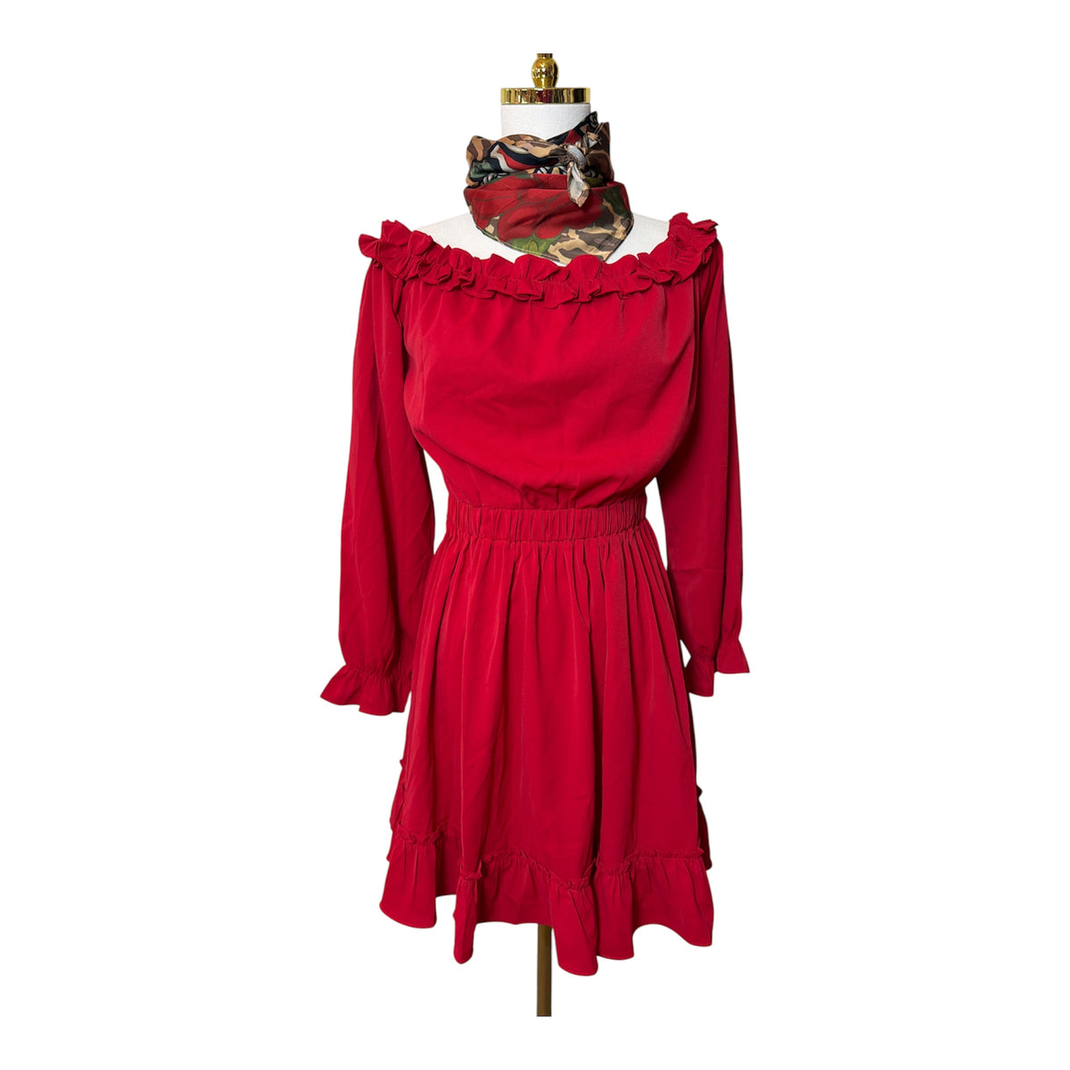 On or off-the-shoulder mini dress with an elastic waist, long sleeves with ruffled cuffs, and a ruffled hem line - M