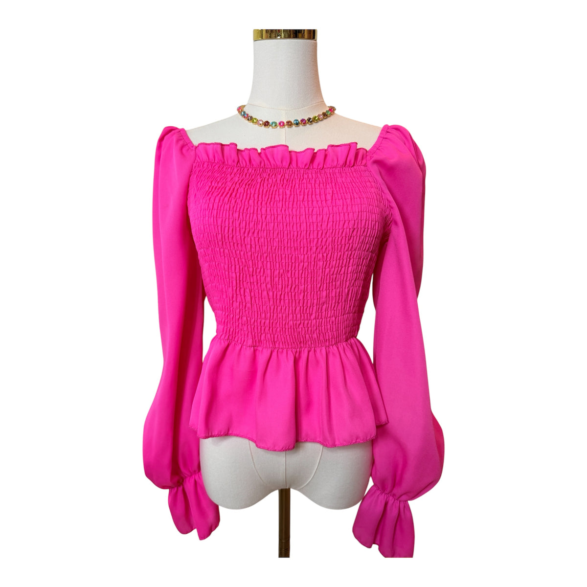 Pink smocked peplum blouse